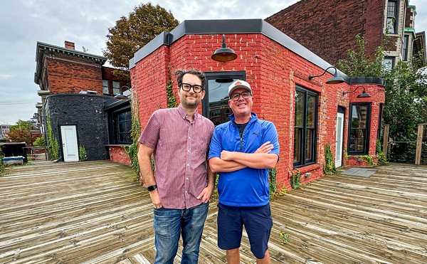 Business partners Sandy Levine (left) and Doug Hewitt (right) on the patio of their forthcoming Midtown bar, Dirty Shake.