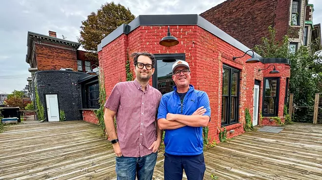 Business partners Sandy Levine (left) and Doug Hewitt (right) on the patio of their forthcoming Midtown bar, Dirty Shake.