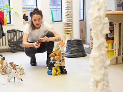 Madeline Isakson, a 3D Design graduate of Cranbrook Art Academy’s program, prepares for the school’s 2022 student exhibition.