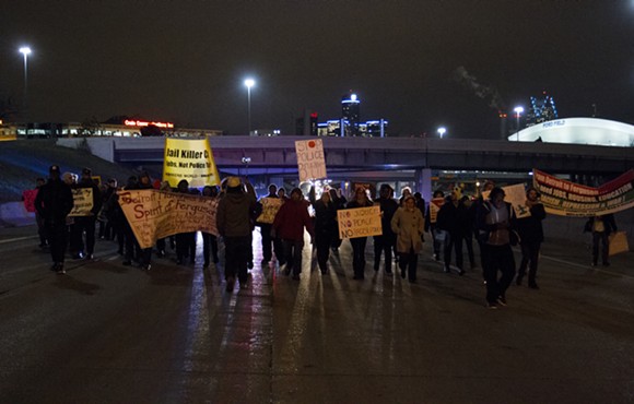 On Tuesday, Nov. 25, 2014, following the announcement that a grand jury would not indict the officer who shot 18-year-old Michael Brown, protesters in Detroit demonstrated across the city, including those seen here on I-75 just south of Mack Ave. - STEVE NEAVLING/MOTOR CITY MUCKRAKER