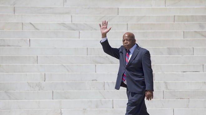 Georgia Congressman John Lewis waves at the 50th Anniversary of the march on Washington and Martin Luther King's I Have A Dream Speech in 2013.