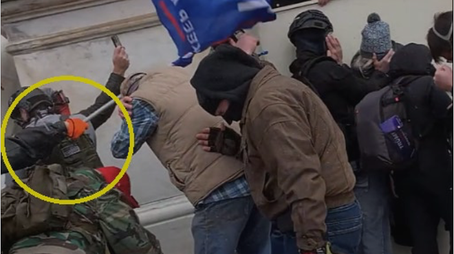 Video shows Isaac Thomas striking an officer with a flagpole at the U.S. Capitol on Jan. 6, 2021.