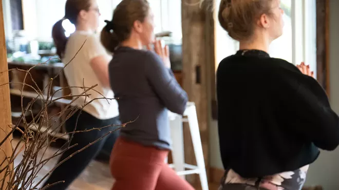 Cannabis retreat guests relax with yoga at a getaway in Clymer, New York.