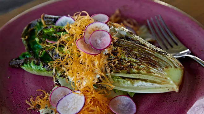 Charred romaine with bottarga dressing, mimolette, and radish from Coeur.