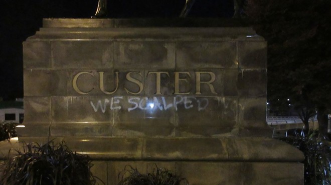 Activists spray-painted a monument to General George Armstrong Custer in Monroe in October 2022.