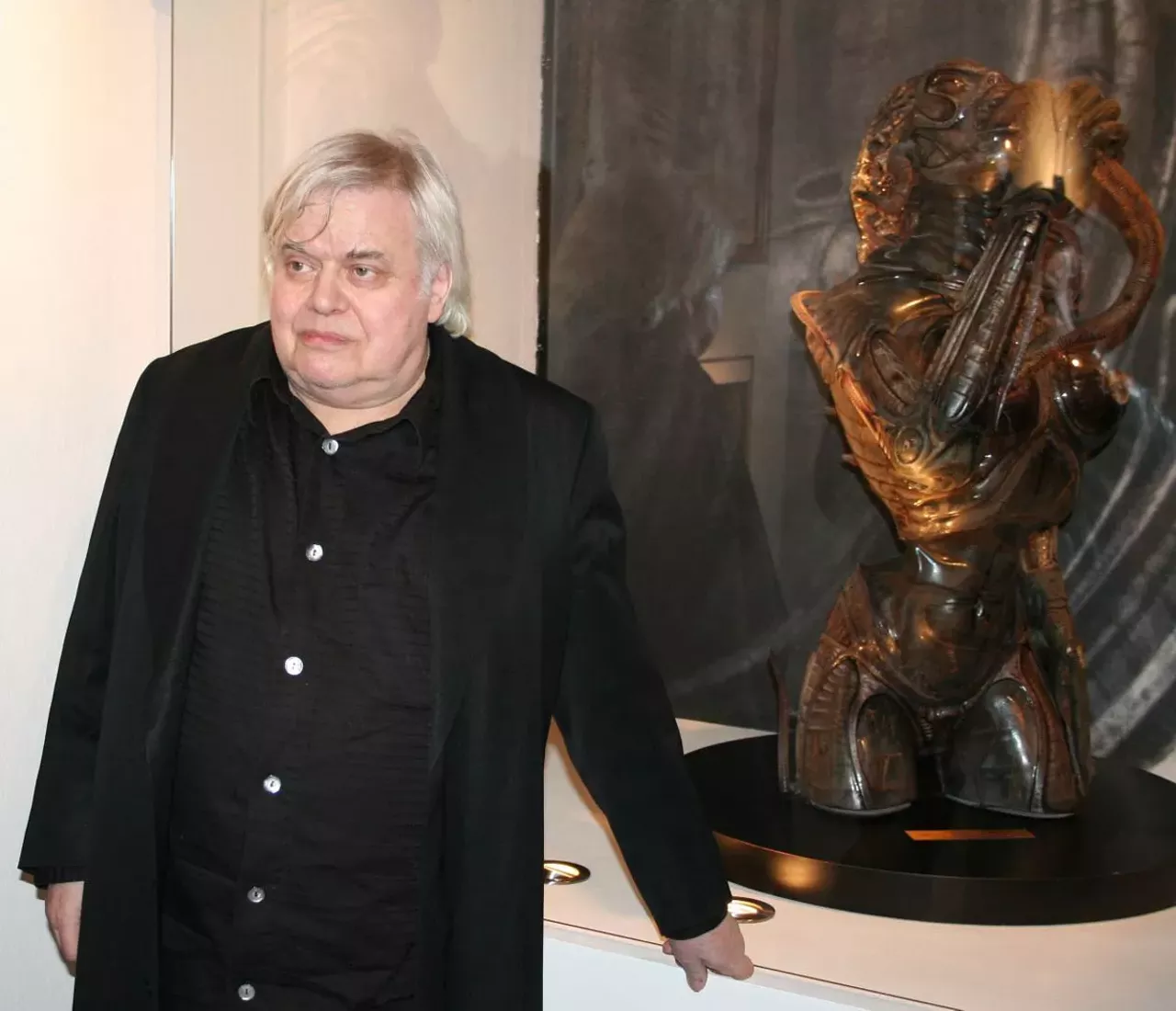 H. R. Giger, 2006 Although we did not know it at the time, H. R. Giger became our first special guest artist. This was before we did juried art calls and the exhibition was mainly a local invitational with a smattering of bigger national artists. We had already promised a spotlight to a photographer whose main claim to fame was nude photos of a pre-famous Madonna he had sold to a men’s magazine. Giger was much cooler and way more important. Giger’s manager Les Barany delivered a variety of signed erotic prints and drawings since Giger was too ill to travel to Detroit (and likely too costly for our budget).