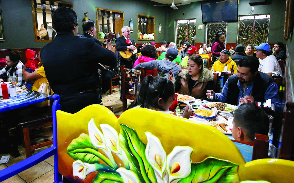 On a chilly November night, a mariachi band serenades diners at Taqueria Nuestra Familia in Detroit.