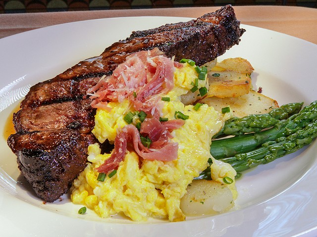 A rib chop, potatoes, asparagus, and corn from Brentwood Grille.