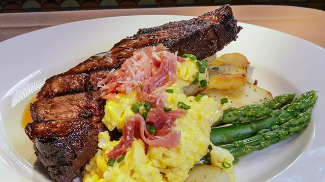 A rib chop, potatoes, asparagus, and corn from Brentwood Grille.