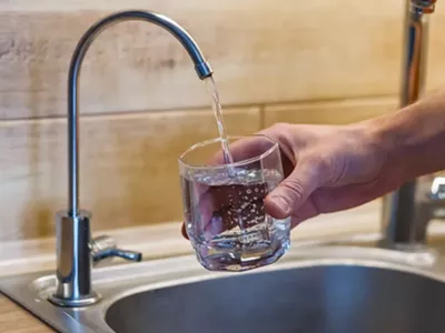 A glass filled with tap water.