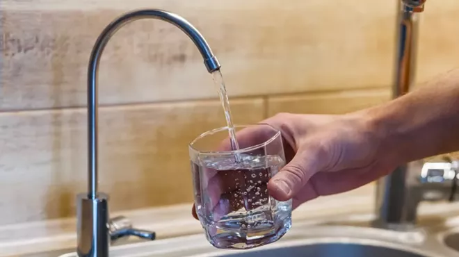 A glass filled with tap water.