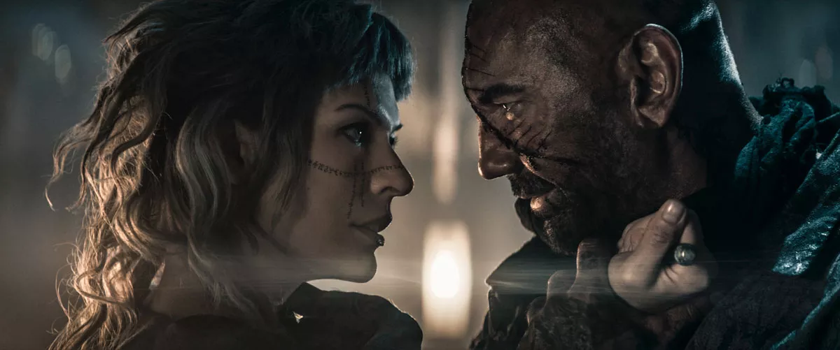 Image: Milla Jovovich and Dave Bautista star in the disappointing In the Lost Lands.