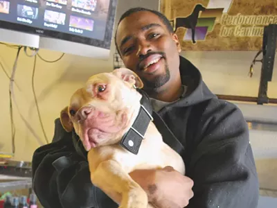 Michael Hodges with his champion pit bull Pow.