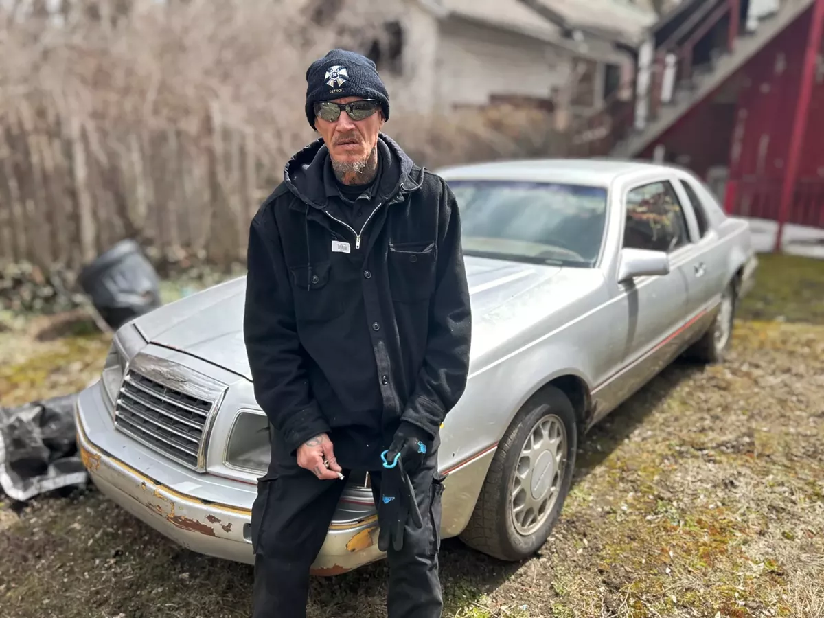 Image: Bob Nelson stands next to his 1985 Ford Thunderbird in Highland Park.