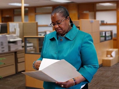 Wayne County Prosecutor Kym Worthy checks papers in Detroit Monday, April 20, 2015.