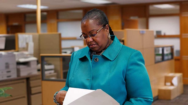 Wayne County Prosecutor Kym Worthy checks papers in Detroit Monday, April 20, 2015.