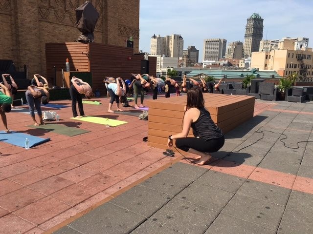 Raise money for Detroit Music Hall while doing yoga on its roof tonight