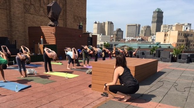 Raise money for Detroit Music Hall while doing yoga on its roof tonight