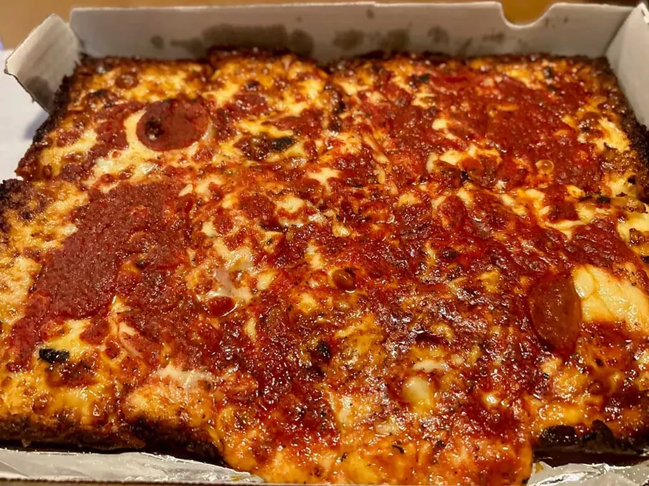 #1 Loui’s Pizza 23141 Dequindre Rd., Hazel Park; louispizza.store If there’s one Detroit-style pizza spot that stands above the rest, it’s Loui’s. Opened in 1977 by pizza legend Louis Tourtois, who previously worked at Buddy’s and Shield’s, Loui’s has built a reputation for delivering some of the best pizza anywhere. It has everything you want in a Detroit-style pie — tasty sauce, perfectly crispy caramelized edges, and more cheese than just about any other pizza I tried. The tangy and bold sauce is ladled generously on top, adding a perfect balance with each bite. Unlike some heavier Detroit-style pizzas, Loui’s keeps the proportions just right with a crust that’s thick but not overwhelming and striking a perfect balance of crunch and fluff. Loui’s also serves its pies in a welcoming, no-frills vibe. When you walk in, you’re surrounded by hanging wine bottles, red-checkered tablecloths, and a cozy, homey atmosphere. It’s no surprise that it’s often considered one of the best pizza joints in the region. For me, it’s the clear winner, one that every Detroit pizza fan needs to experience at least once.