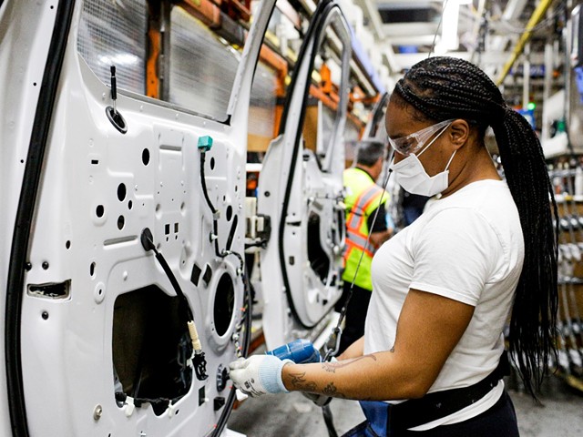 A woman working at Ford's Dearborn truck plant.