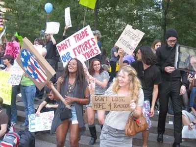 Protestors shake it to the beat of drums at the edge of New York City’s Liberty Park on Saturday