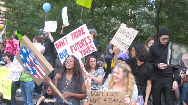 Protestors shake it to the beat of drums at the edge of New York City’s Liberty Park on Saturday