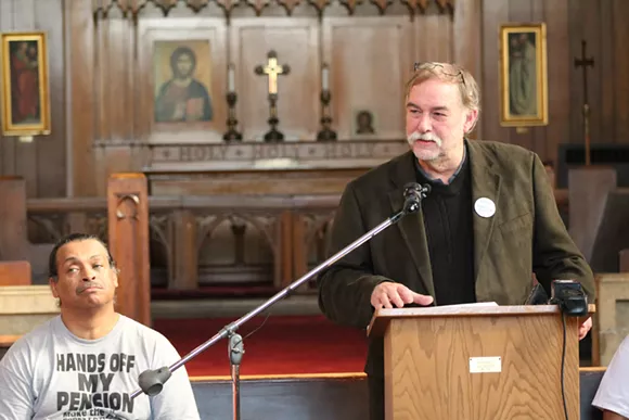 Rev. Bill Wylie-Kellermann, of the St. Peter's Episcopoal Church, speaks during a press conference on Nov. 10, 2014. - Ryan Felton/Metro Times