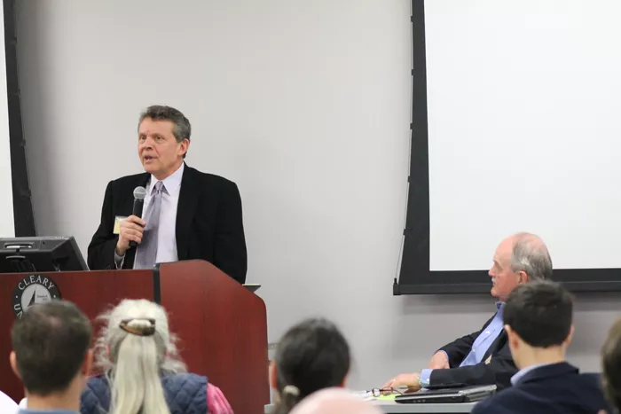 Rich Robinson, Executive Director of the Michigan Campaign Finance Network speaks at the Michigan Election Reform Conference at Cleary University in Ann Arbor last week. - Photo by Ryan Felton.