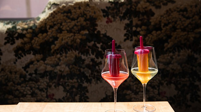 Pinky's Ice Pops — a glass of wine glass with a liquor-infused ice popsicle sticking out of it.