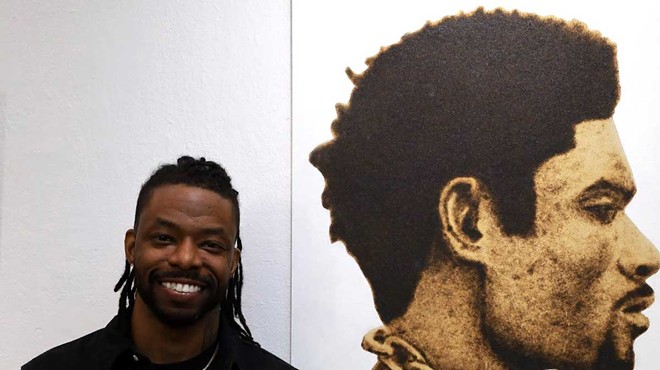 Emerging artist Terrell Anglin uses wood burning and mixed media techniques to connect the past and present of the African American experience.