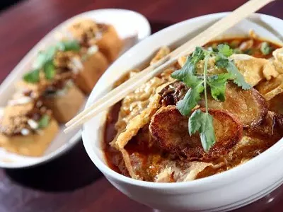 Curry Mee with Young Tao Fu, noodles in spicy lemon grass coconut curry with vegetables and tofu sfuffed with minced shrimp and fish meat, from Satay House in Madison Heights.