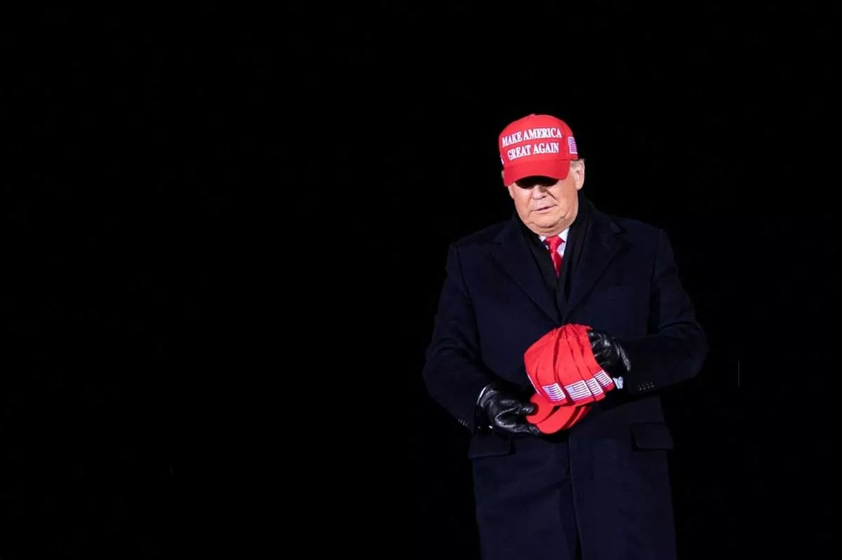 Image: Then-President Donald Trump arrives for his final Make America Great Again rally at Gerald R. Ford International Airport Nov 3, 2020, in Grand Rapids.