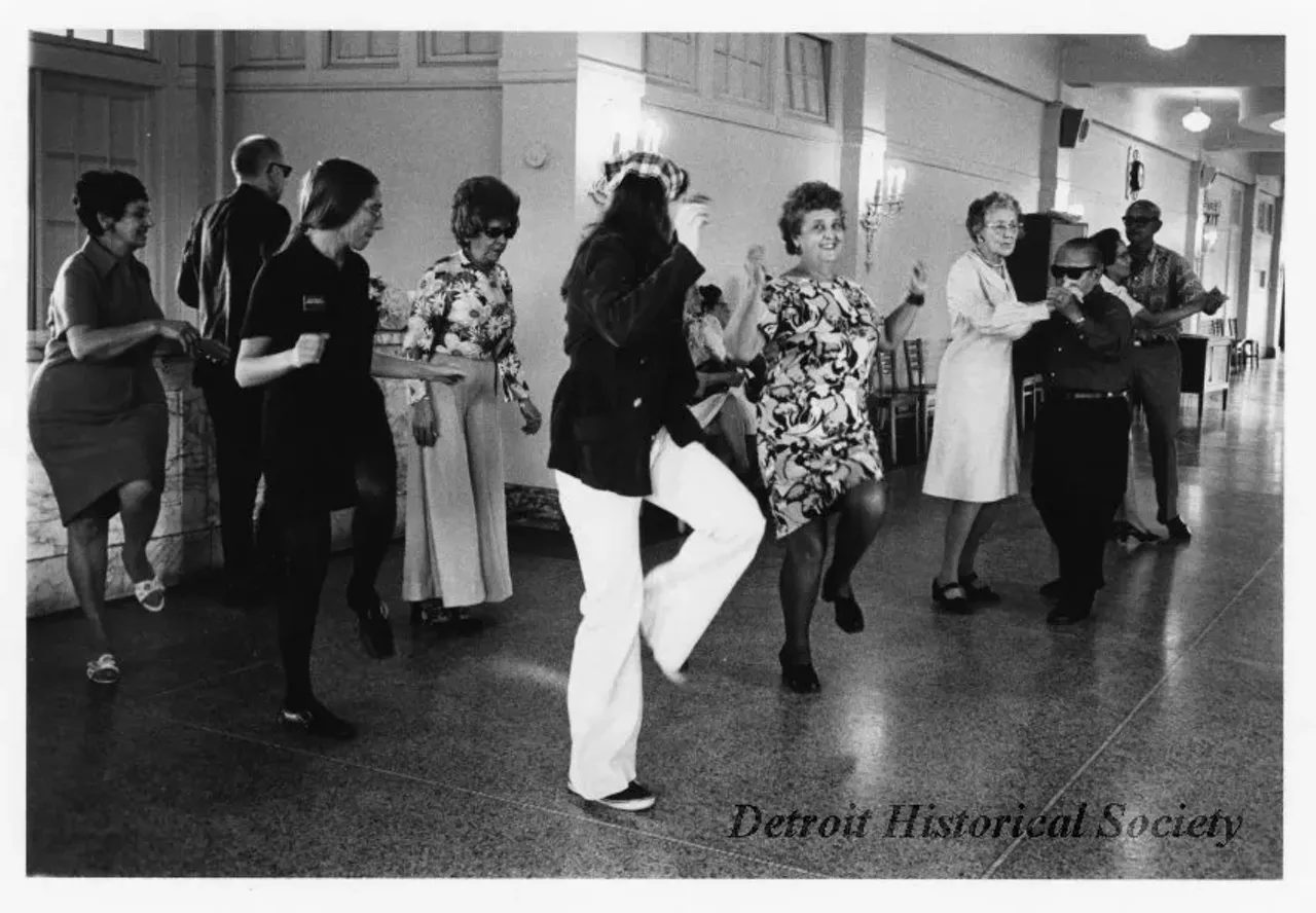 "Black and white photographic print mounted on board depicting a dance lesson for senior citizens at the Belle Isle Casino."