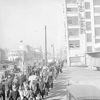 March 17, 1937: Striking auto workers walk a picket line near the Chrysler plant on Jefferson Avenue in Detroit.