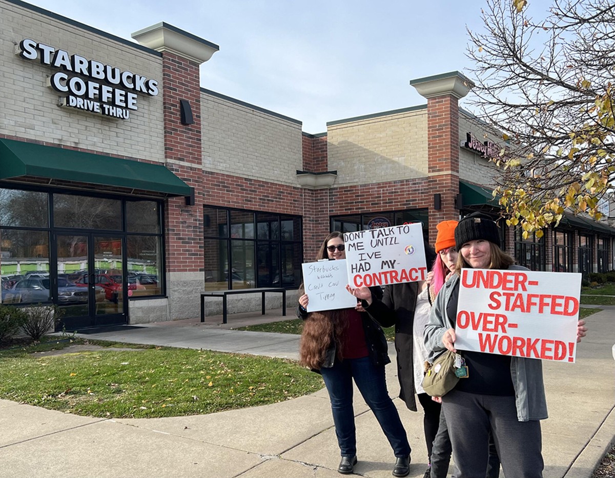 Cara Parker, 42 (far left) with fellow workers outside Pittsfield Township Starbucks store.