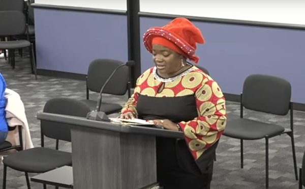 Juanita Francis, aka Mama J., speaks to the school board about her dismissal.