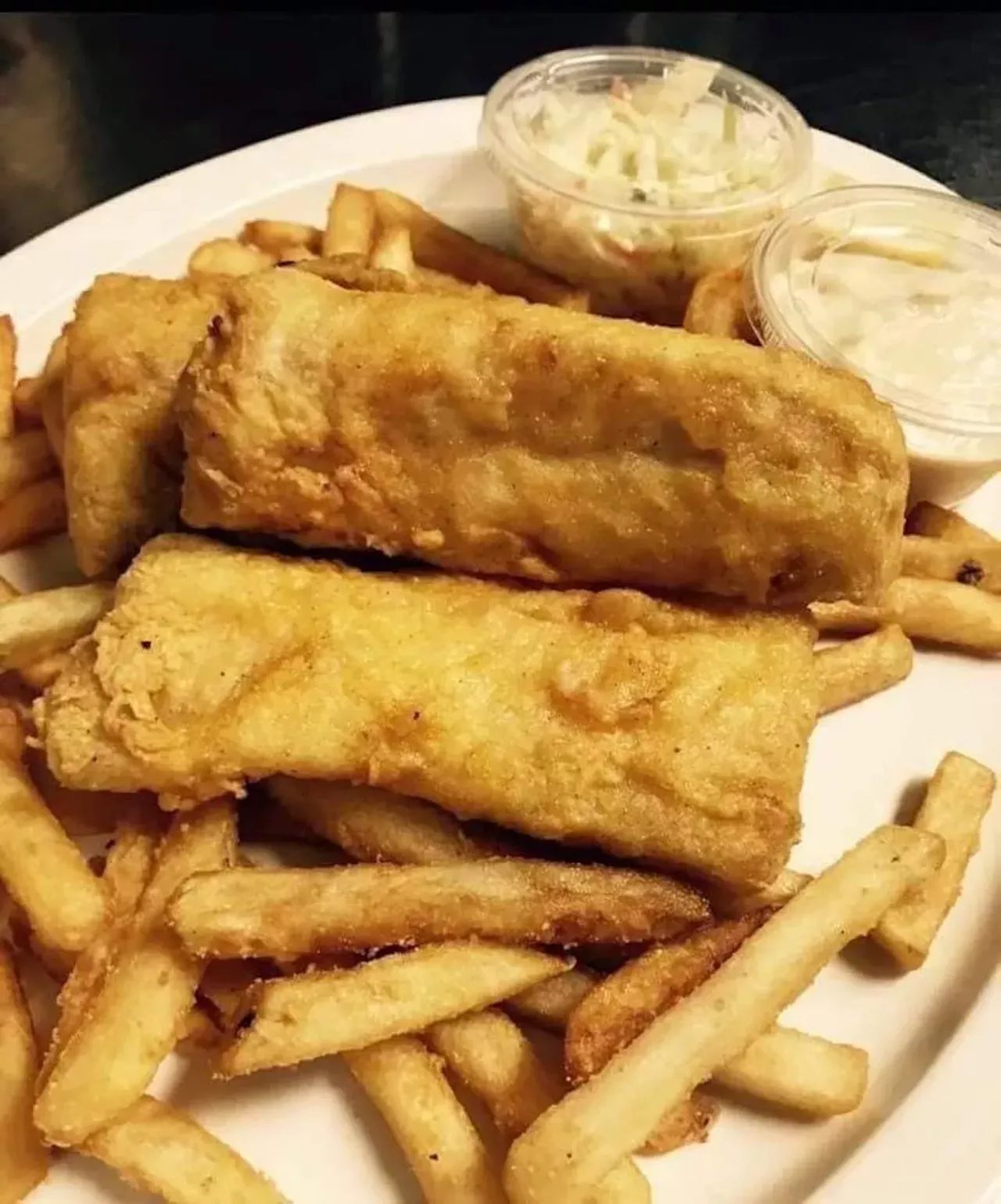 Crow's Nest Bar and Grill 6166 N. Canton Rd., Canton; 734-459-4020; crowsnestcanton.com All-you-can-eat fish and chips are available every Friday and include cod hand-dipped in a light, beer-batter, served with fries and coleslaw. Photo via Crow's Nest Bar and Grill/Facebook