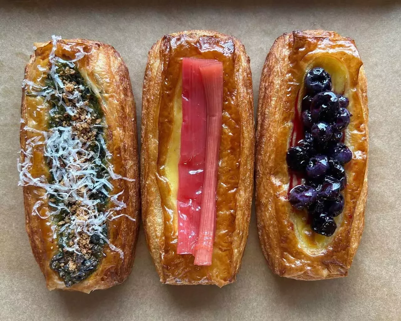 Layered Pastries at Forest Bakery Croissants, Danish, and pain au chocolat are all made with amazingly flaky, tender layers of pastry and imported French butter — literally 27 of each. Varieties of Danish are both sweet and savory: Apple Butter-Vanilla Custard-Oat Streusel; Spinach and Artichoke Dip; French Onion Soup; Brie-Bechamel-Cranberry Jam, and I’ve seen a Danish filled with raspberries — but it’s the pastry itself that’s the star. Croissants might be filled with pistachios but are heavenly on their own. The chocolate buried in a pain au chocolat is Valrhona, one of France’s best. The three young owner-operators do all the work themselves, and it shows. —Jane Slaughter 