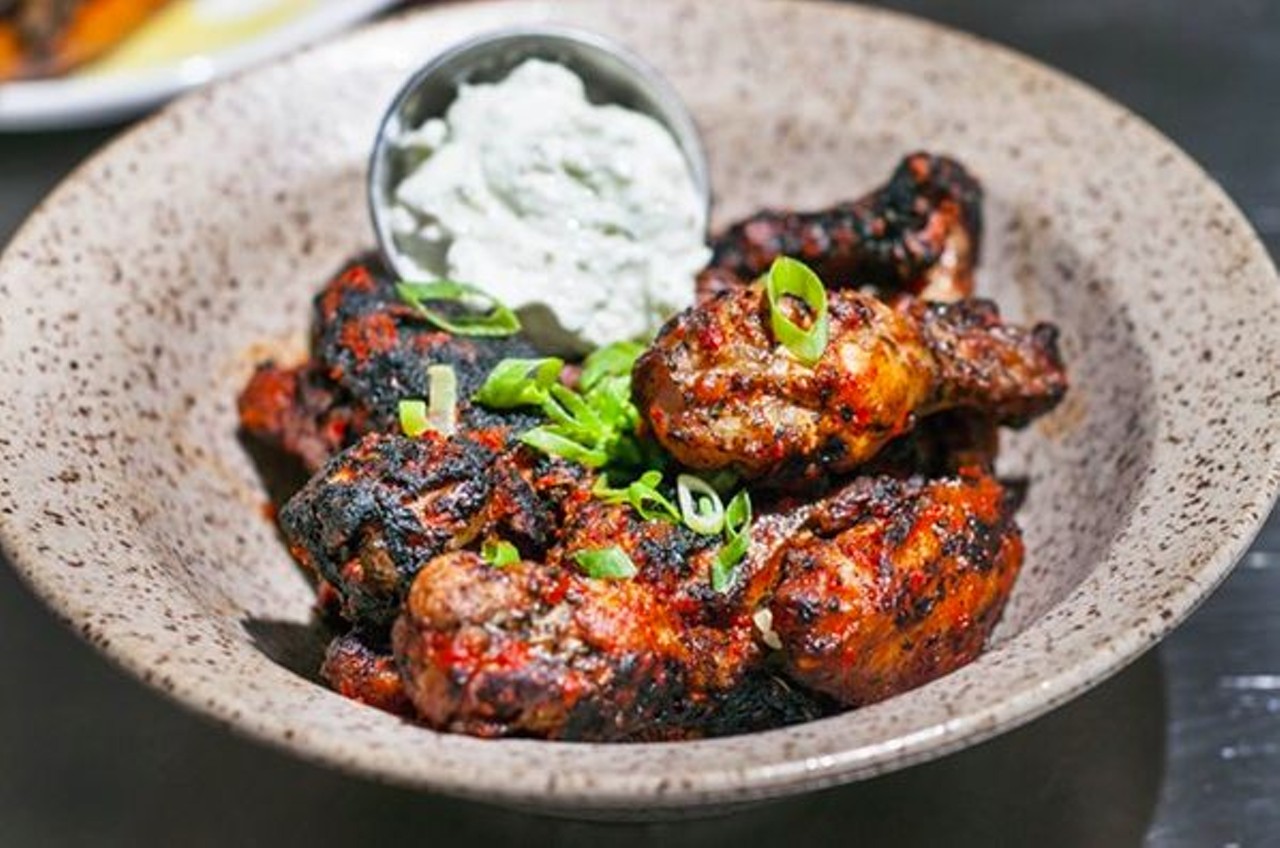 These are the type of wings that leave a little sting on your tongue, but not too much so &#151; Gather achieves the perfect heat level. What sets the deeply flavorful, green onion-studded wings apart is the dimension added by cooking them above open flame on a wood-fire grill. Served with plenty of green onions and a celery-yogurt sauce &#151; it's the best wing accompaniment in Detroit.
Photo by Tom Perkins
