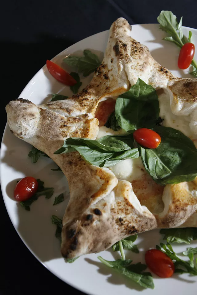 The Fellini (House Specialty) star shaped margherita pizza with vegetable stuffed corners from Antica Pizzeria Fellini in Royal Oak.