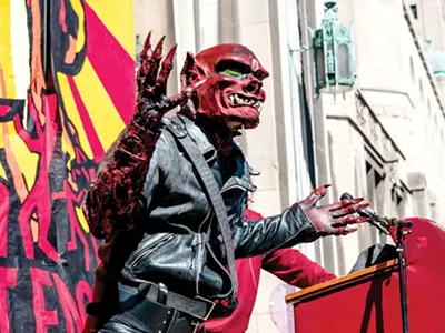 The "Red Dwarf" speaks at the Marche du Nain Rouge, 2015.