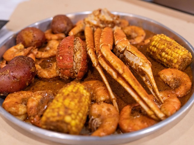 The Red Sea Platter includes snow crab, shrimp, mussels, corn, redskins, and rice.
