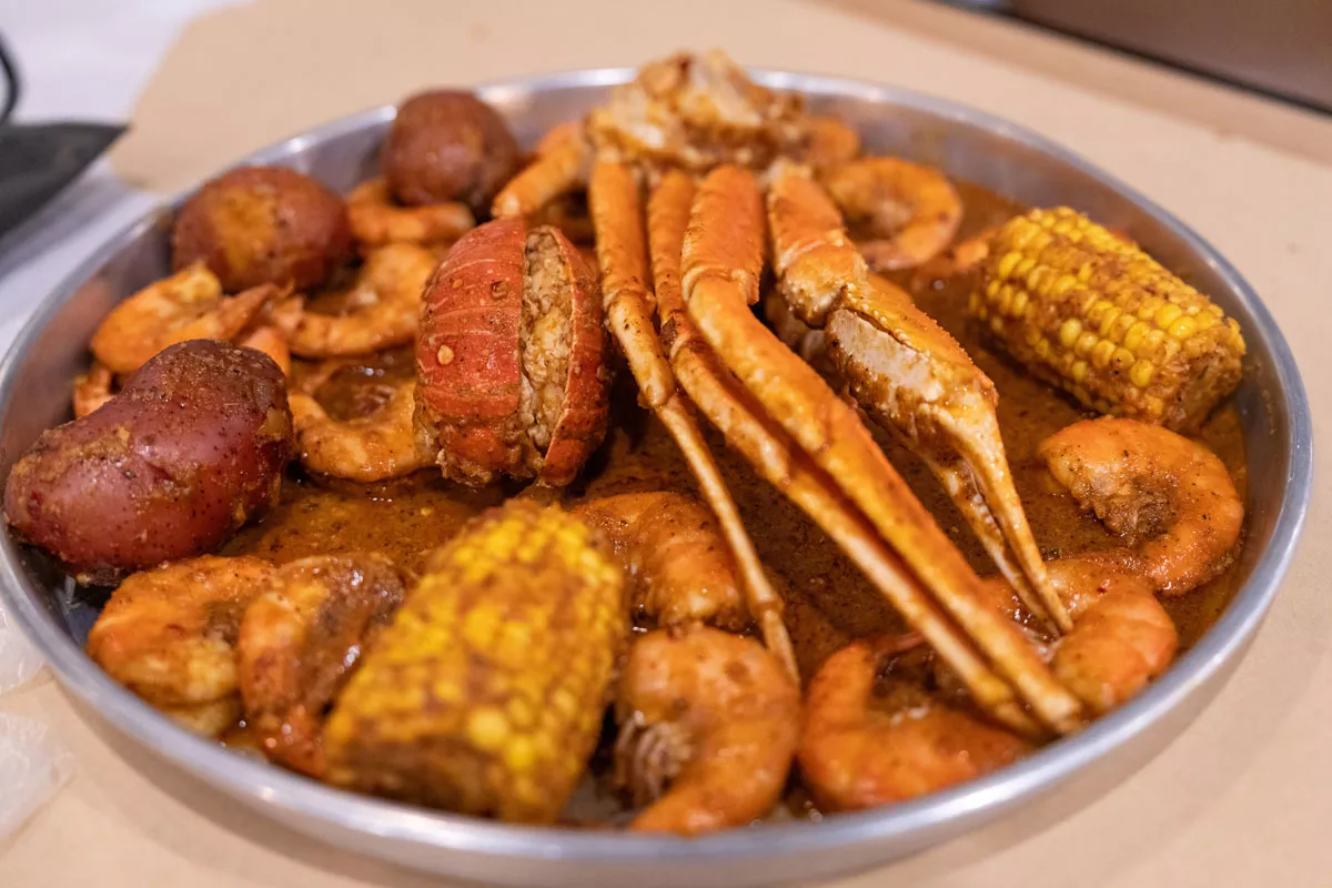 The Red Sea Platter includes snow crab, shrimp, mussels, corn, redskins, and rice.