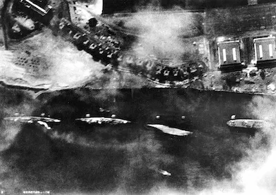 The western side of Ford Island on Dec. 7, 1941, during the attack. Farthest to the left is the USS Detroit, which was damaged that day. - U.S. Navy (captured Imperial Japanese Navy photo)