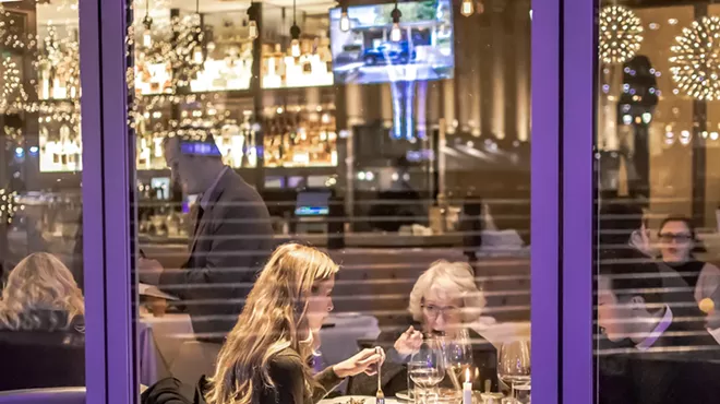 Two women eating at Detroit's Parc in 2019.