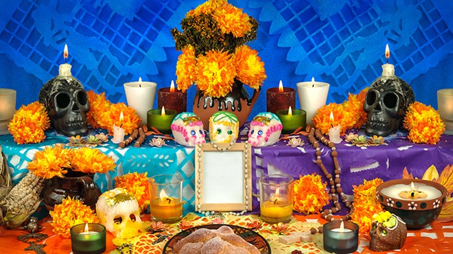 Tokens of departed family members’ favorites are staged at an ofrenda.