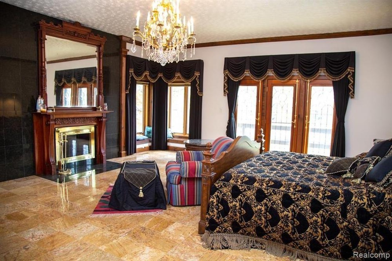 This $1.2 million marble-loving mansion in Grosse Ile has a sexy indoor pool