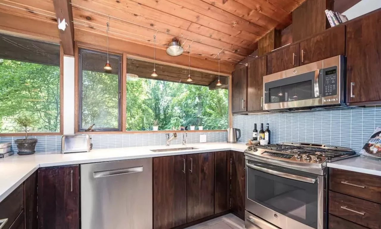 Image: This $585k zen AF Ann Arbor home has a pergola and koi pond