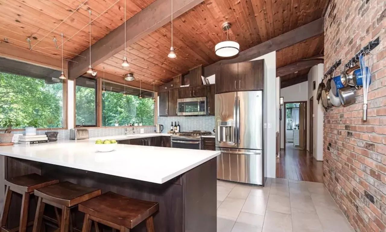 Image: This $585k zen AF Ann Arbor home has a pergola and koi pond