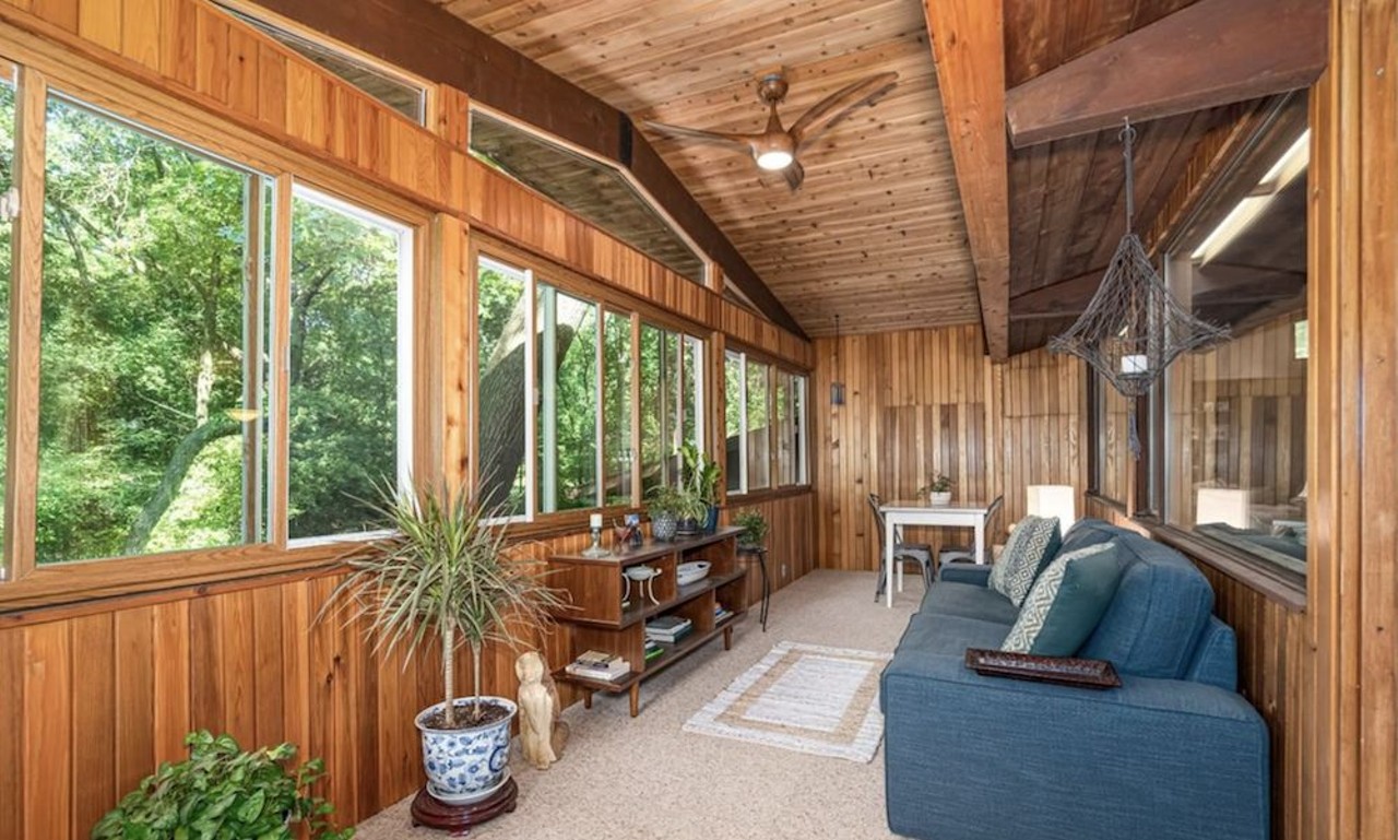This $585k zen AF Ann Arbor home has a pergola and koi pond